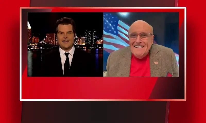 Video still from The Matt Gaetz Show on One America News Network showing a split screen of the host on the left side, and on the right side is the guest, Rudy Giuliani.