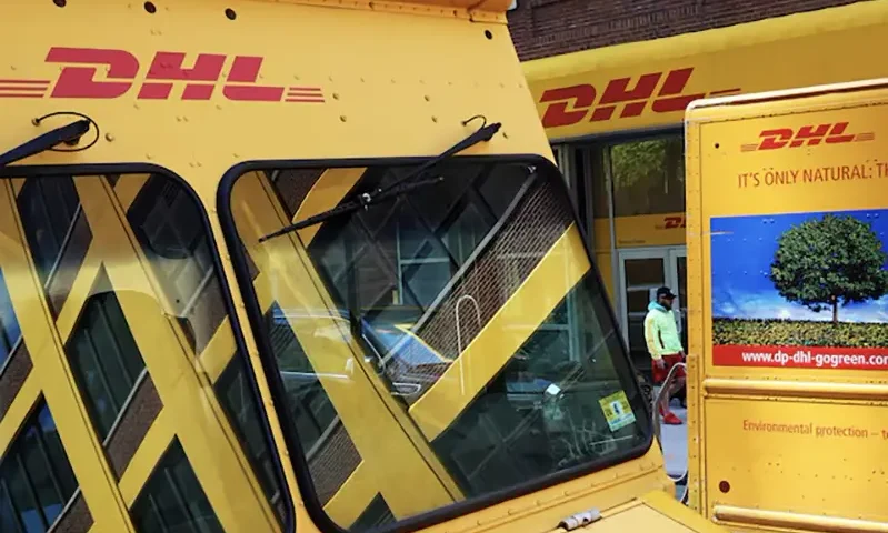 Trucks are parked outside a DHL delivery facility in Manhattan, New York City, U.S., May 9, 2022. REUTERS/Andrew Kelly
